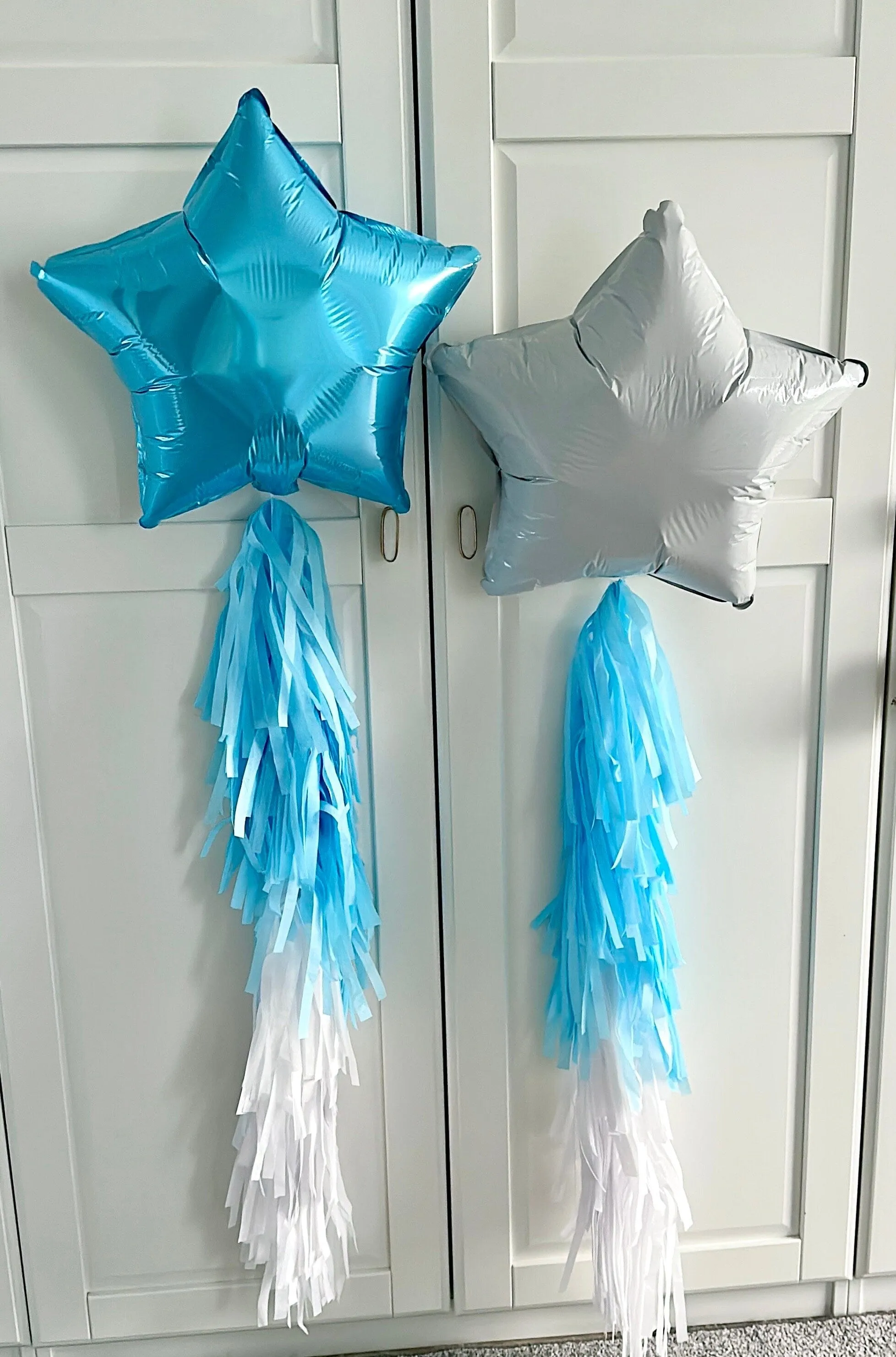 White and blue star shaped balloons with tassel tail ice winter wonderland birthday decorations- fully assembled ready to use